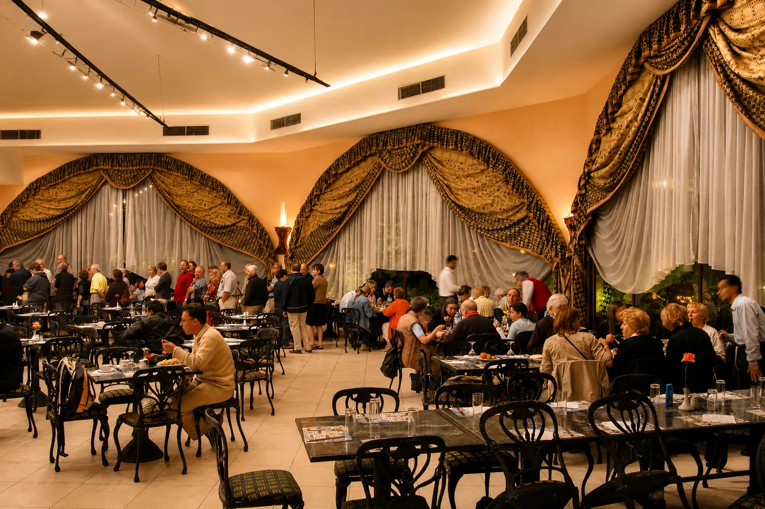 Guests dining in the main restaurant in the evening