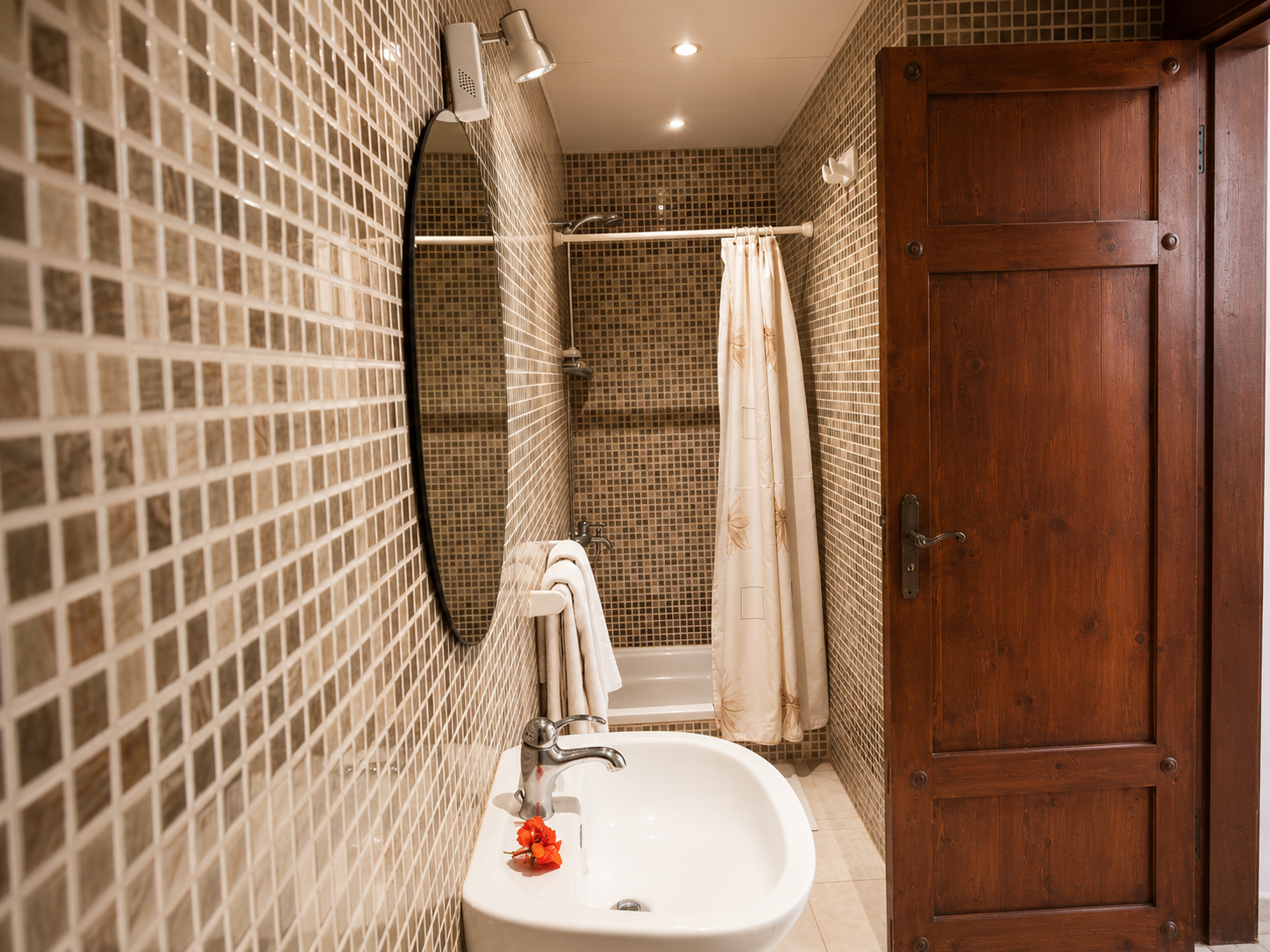 Close-up of a bathroom vanity and shower area